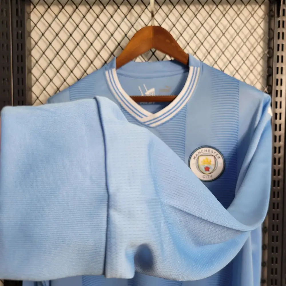 Manchester City 23/24 Home Long Sleeve Jersey - Authentic Citizens Kit | Premier League Champions - Close-up of Manchester City crest and jersey details