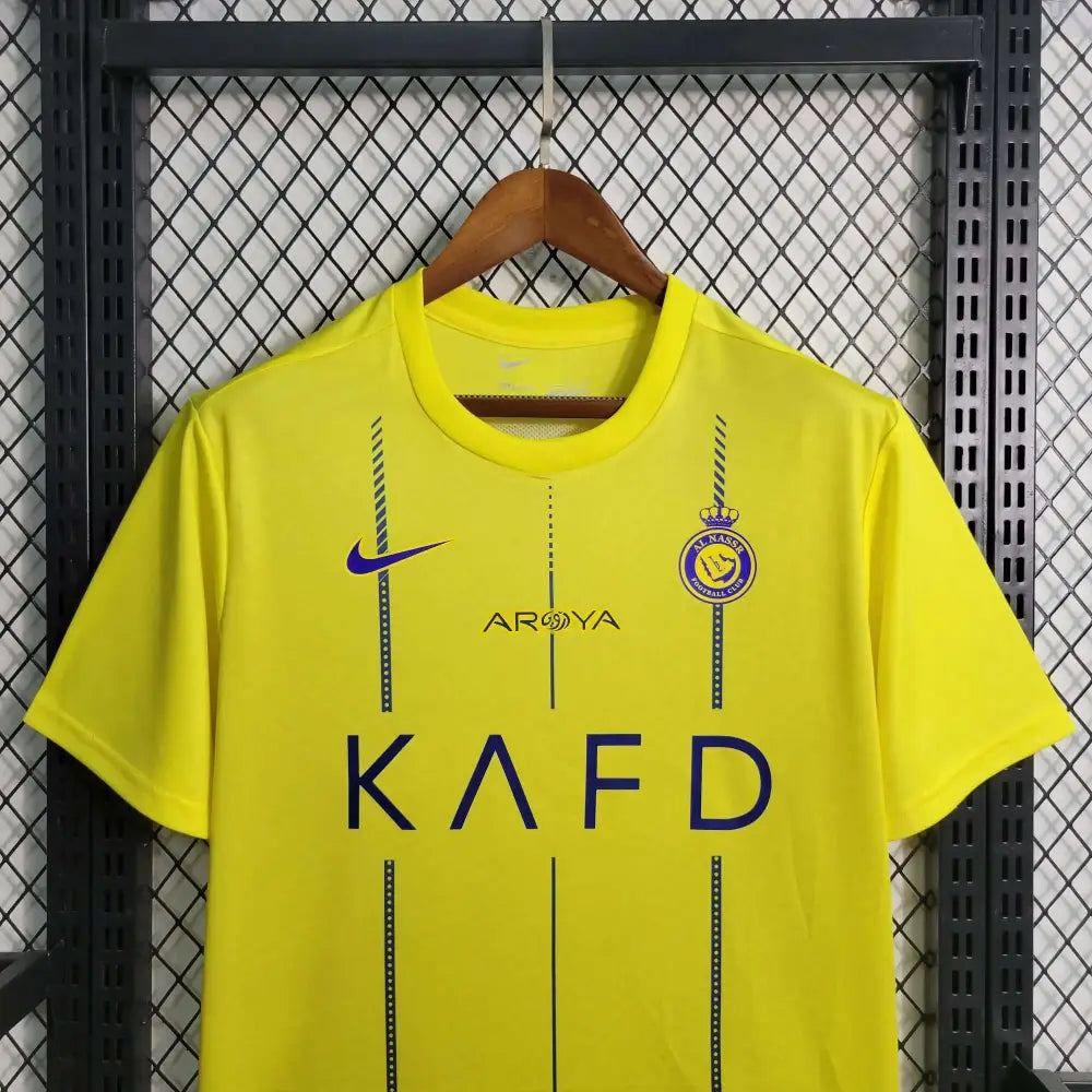 Al Nassr 23/24 Home Jersey - Close-up of FUTBOLSPLY crest and jersey details