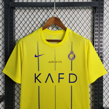 Al Nassr 23/24 Home Jersey - Close-up of FUTBOLSPLY crest and jersey details