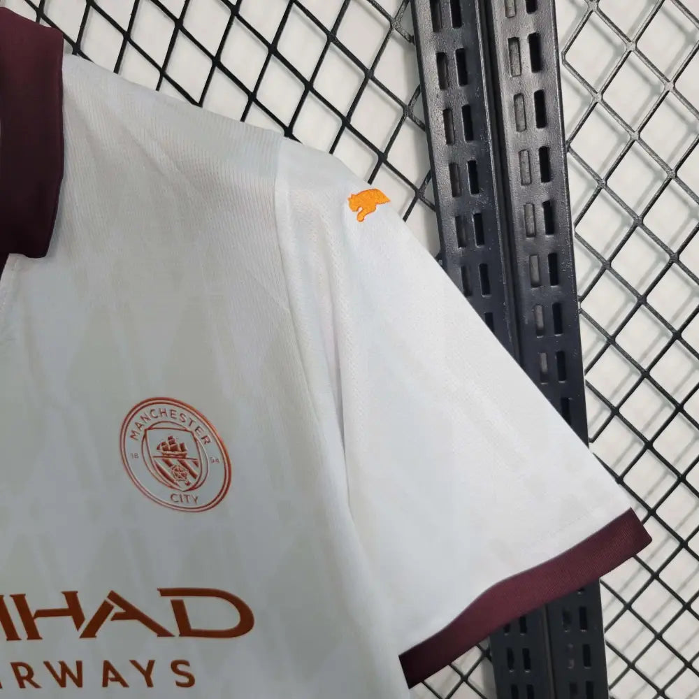 Manchester City 23/24 Away Jersey - Close-up of Manchester City crest and jersey details