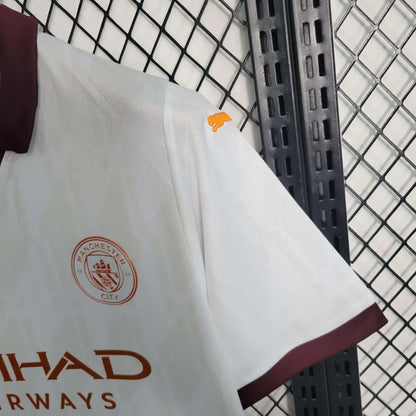 Manchester City 23/24 Away Jersey - Close-up of Manchester City crest and jersey details