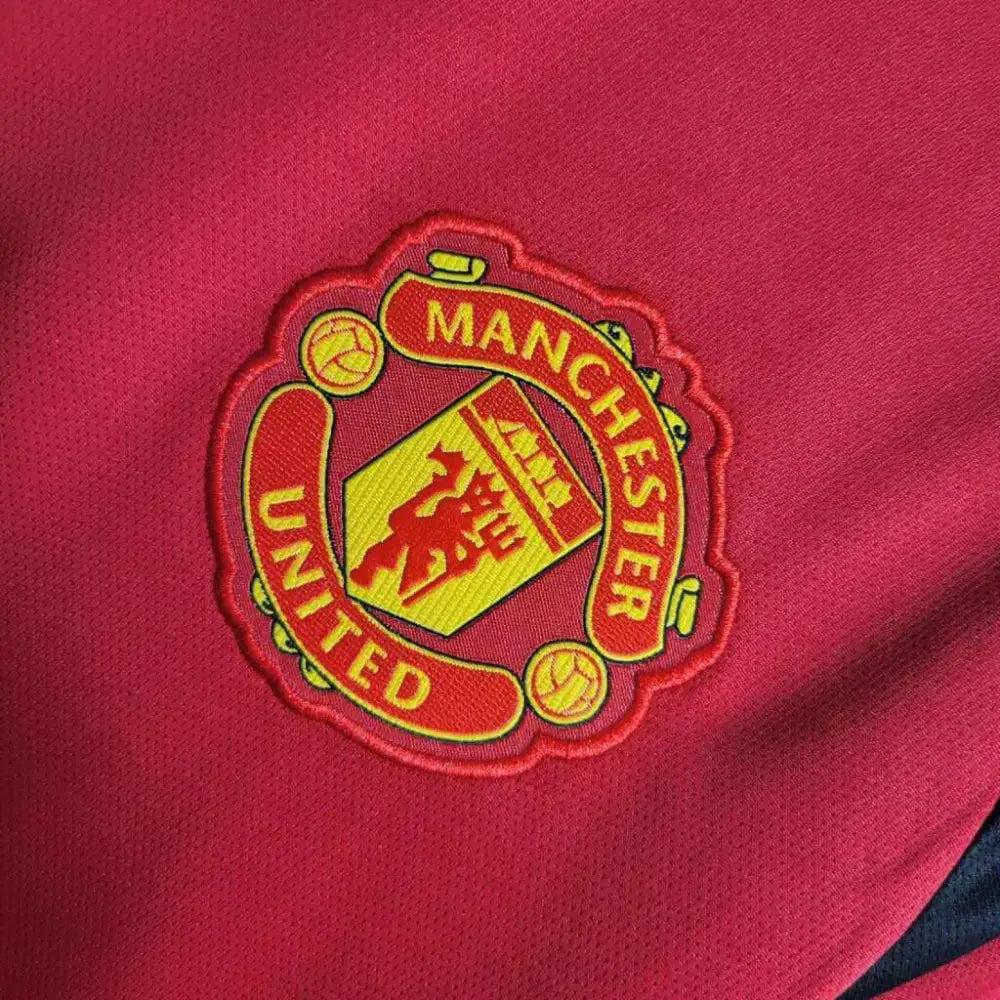 Manchester United 24/25 Home Jersey - Close-up of Manchester United crest and jersey details