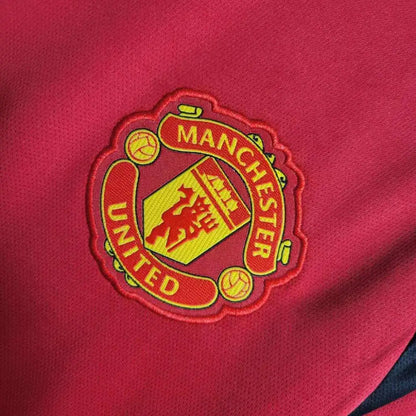 Manchester United 24/25 Home Jersey - Close-up of Manchester United crest and jersey details