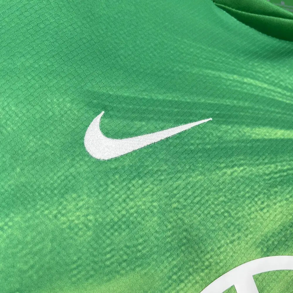 Wolfsburg 25/26 Home Shirt - Close-up of FUTBOLSPLY crest and jersey details